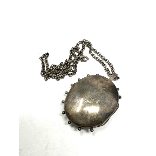 333 - A large silver Victorian revival locket and chain (67g)