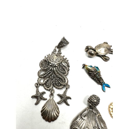 331 - Six silver pendants including an enamel lucky fish (39g)