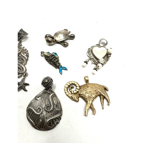 331 - Six silver pendants including an enamel lucky fish (39g)