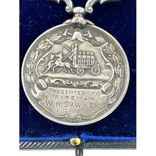 467 - Antique silver fire brigade long service medal june 1911, presented to W.H. Sawyer on registration a... 