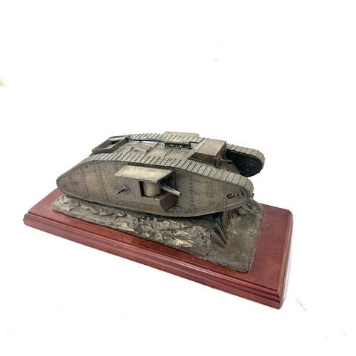 48 - Resin tank ornament on wooden base measures approx 12 inches long