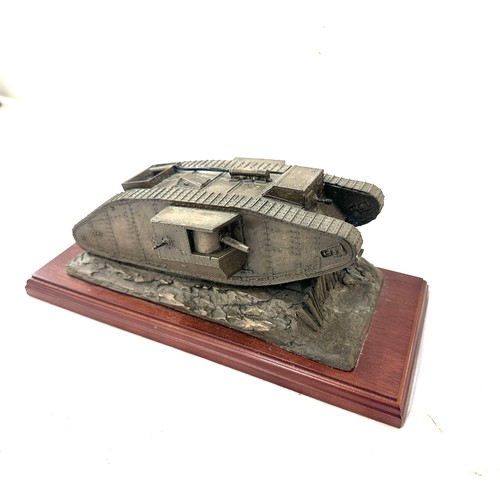 48 - Resin tank ornament on wooden base measures approx 12 inches long