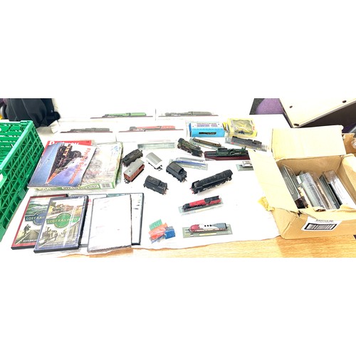 98 - Large selection of train and railway accessories to include engines, DVDS, model railways etc