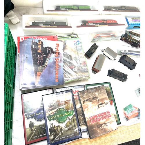 98 - Large selection of train and railway accessories to include engines, DVDS, model railways etc