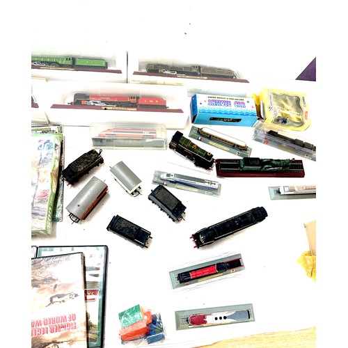 98 - Large selection of train and railway accessories to include engines, DVDS, model railways etc