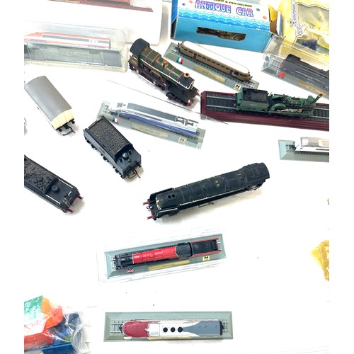 98 - Large selection of train and railway accessories to include engines, DVDS, model railways etc