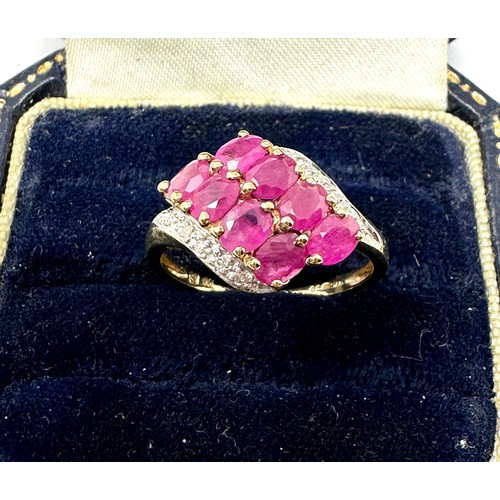 158 - 9ct gold diamond & synthetic ruby dress ring (2.5g)