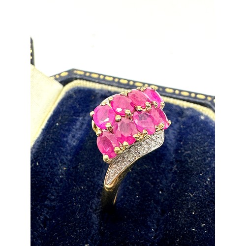 158 - 9ct gold diamond & synthetic ruby dress ring (2.5g)