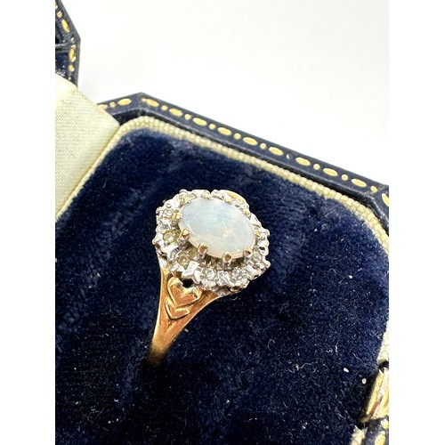 275 - 9ct gold diamond & opal oval cluster ring (2g)