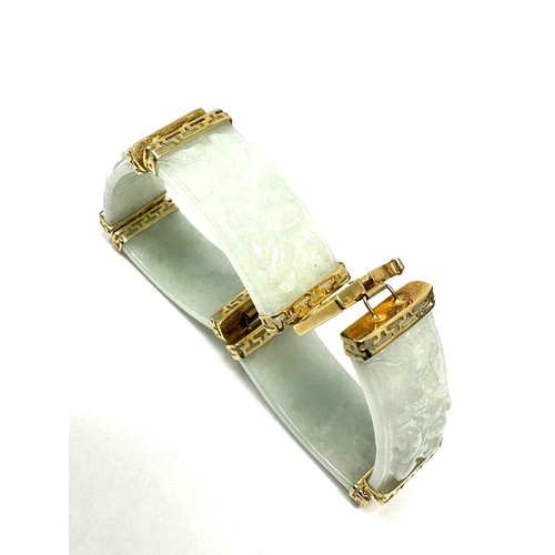 233 - 14ct gold jade oriental style panel bracelet (31.4g)