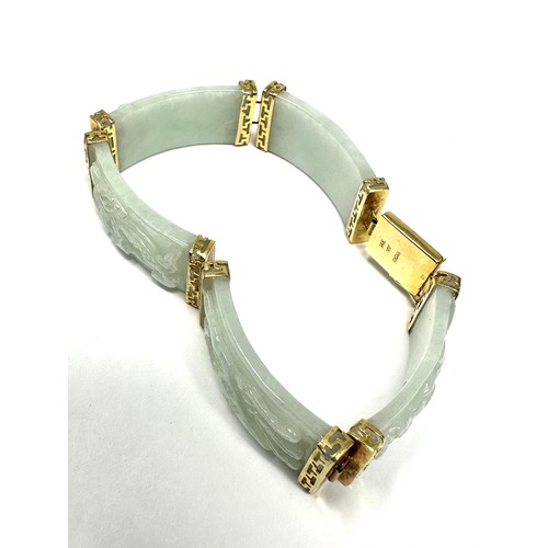 233 - 14ct gold jade oriental style panel bracelet (31.4g)