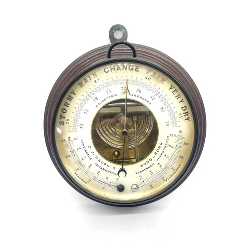 482 - C J Gaupp & Co Hong Kong wall hanging circular barometer, approximate diameter 8.5 inches