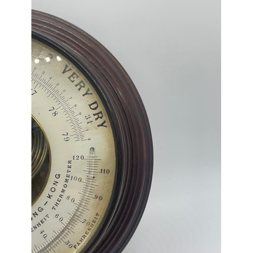 482 - C J Gaupp & Co Hong Kong wall hanging circular barometer, approximate diameter 8.5 inches