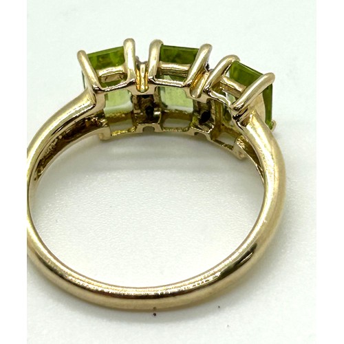 411 - 9ct gold peridot and diamond ring UK size M. Gross weight 2.6 grams