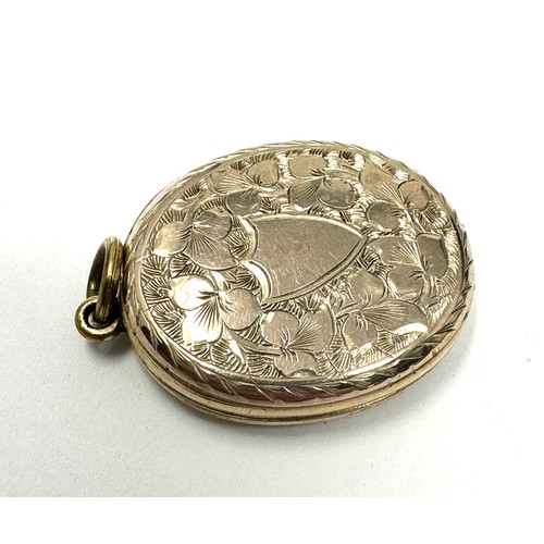 192 - 9ct gold back & front antique patterned locket (8.1g)