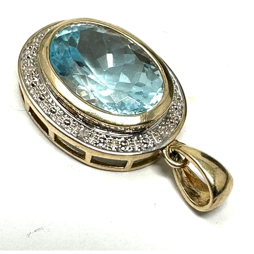 118 - 9ct gold topaz and diamond pendant measures approx 3cm drop by 1.6cm wide weight 4.1g