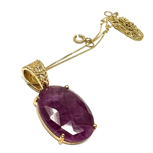 121 - 9ct gold ruby stone set pendant necklace measures approx 2.7cm drop by 1.3cm wide weight 3.6g