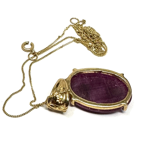 121 - 9ct gold ruby stone set pendant necklace measures approx 2.7cm drop by 1.3cm wide weight 3.6g