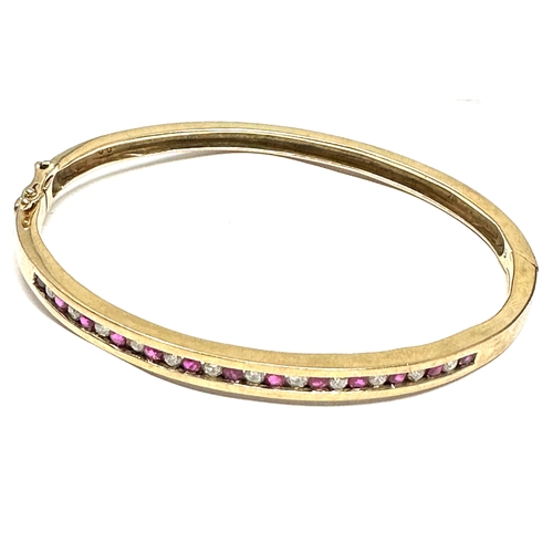 148 - 9ct gold ruby & diamond ring weight 15g