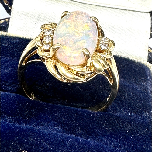 149 - fine 18ct gold opal & diamond ring set with large opal measures approx 16mm by 8.5mm with diamond sh... 