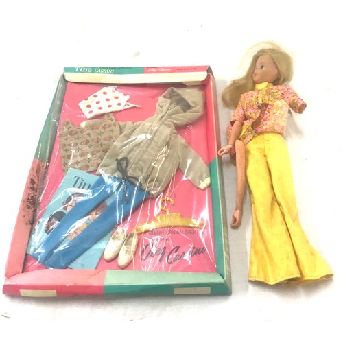 67 - Vintage 1966 matell doll and a Tina Cassini outfit, damaged to doll