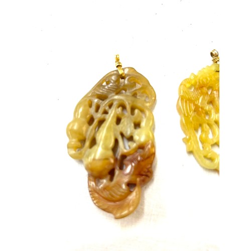 421 - 2 Carved jade chinese pendants