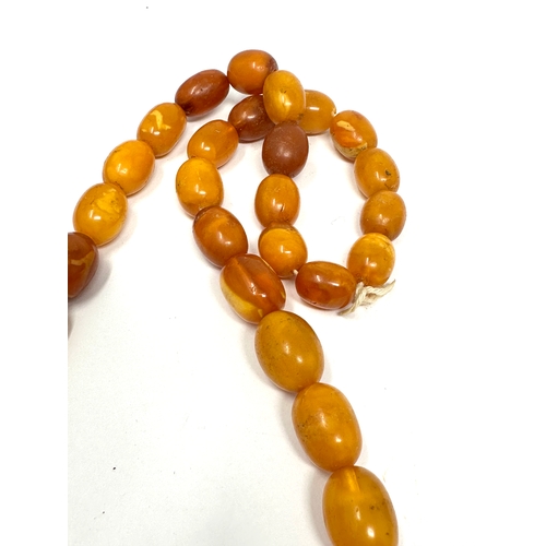 153 - Egg Yolk amber bead necklace weight 66g