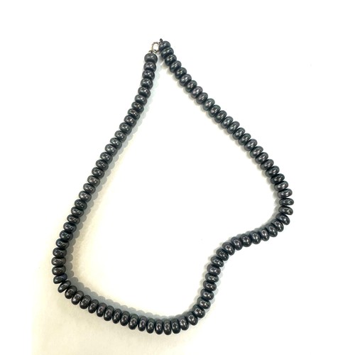 446 - Black pearl necklace 17 inches with 9ct gold clasp