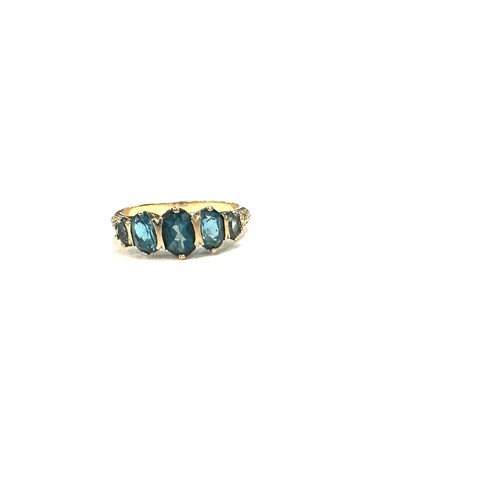 445 - 9ct gold ting with london blue topaz stones unmarked but tested 9ct size R weight 3.2 grams