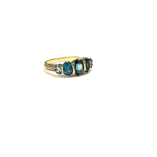 445 - 9ct gold ting with london blue topaz stones unmarked but tested 9ct size R weight 3.2 grams