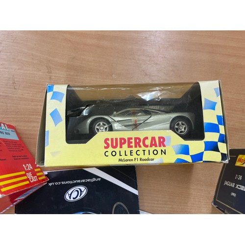 82 - Boxed Revell Porsche 959, Maisto supercar McClaren F1 road car, Jaguar XC220, together with car maga... 