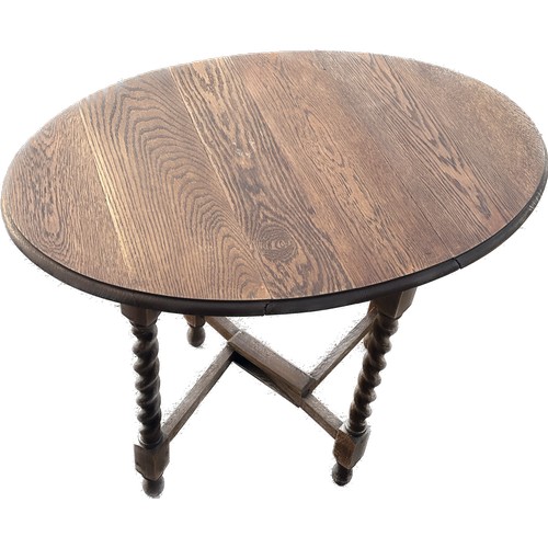 307 - Oak gate barley twist leg table measures approx 29.5 inches tall by 36 inches wide and 24 inches dee... 