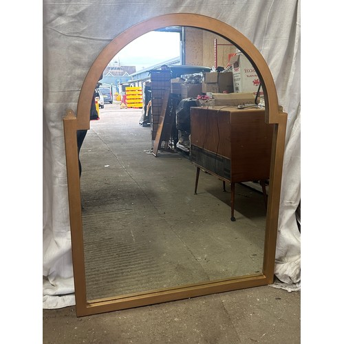 279 - Large oval topped framed mirror measures approx 52 inches tall by 38.5 inches wide