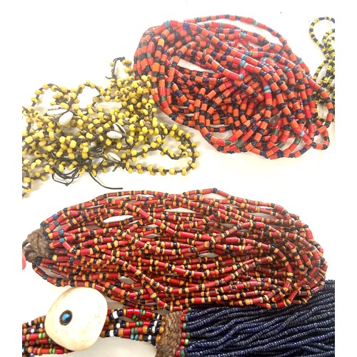 477 - Naga tribal beadwork necklace together with a selection of other bead necklaces