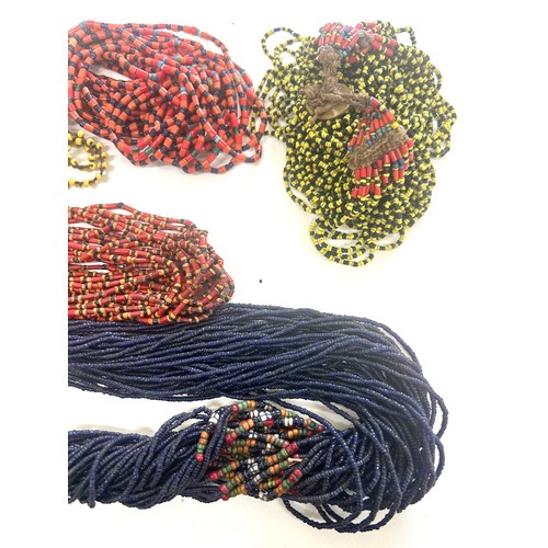 477 - Naga tribal beadwork necklace together with a selection of other bead necklaces