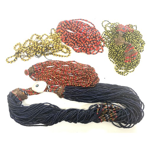 477 - Naga tribal beadwork necklace together with a selection of other bead necklaces