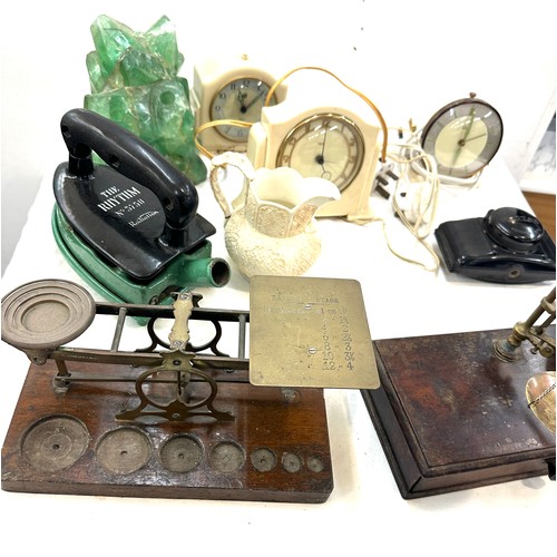 184 - 2 sets brass scales 1 postal scales, 1 balance scales and 3 bakelite clocks etc