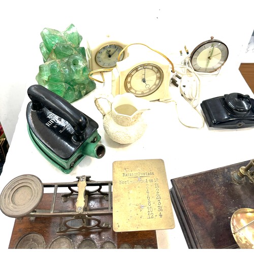 184 - 2 sets brass scales 1 postal scales, 1 balance scales and 3 bakelite clocks etc