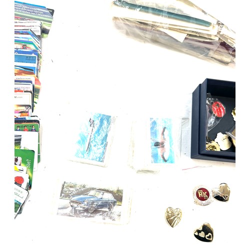 76 - British and world stamps, phone cards, cigarette cards badges etc