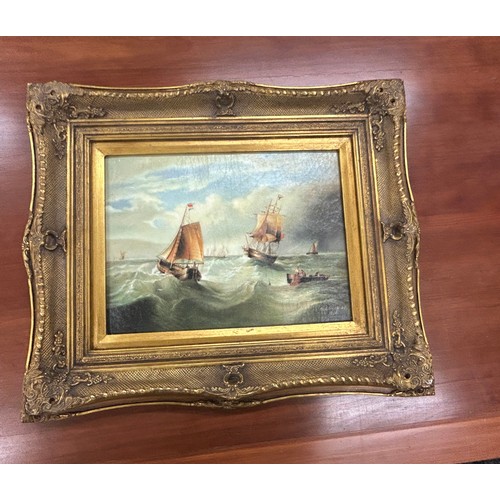 24 - Gilt framed oil on boards depicting gallions measures approximately 24 inches tall 19 inches wide