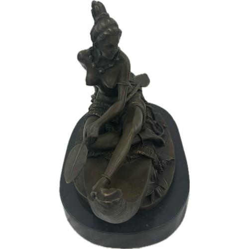 408 - Duchoiselle, a bronze study of a Native American woman in canoe, with impressed mark, on marble base... 