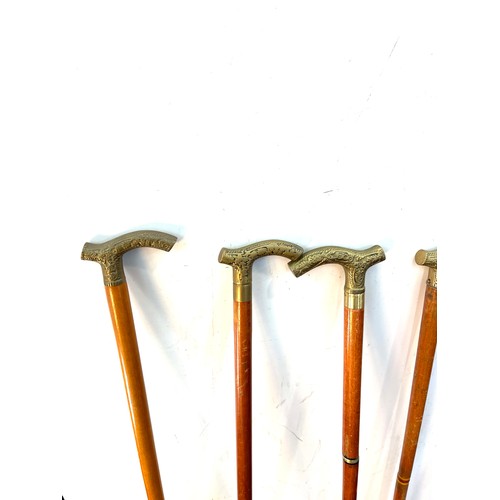 106 - Selection of vintage wooden walking sticks with brass handles (6 in total)