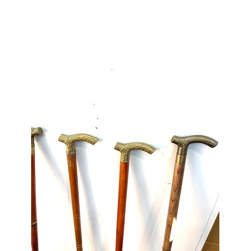 106 - Selection of vintage wooden walking sticks with brass handles (6 in total)