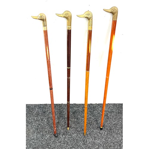 105 - Selection of vintage wooden walking sticks with brass duck head handles (4 in total)