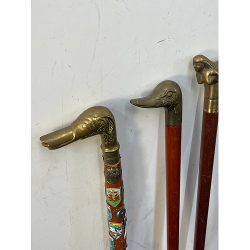 107A - Selection of vintage wooden walking sticks with brass handles includes mermaid, duck, dog and horse