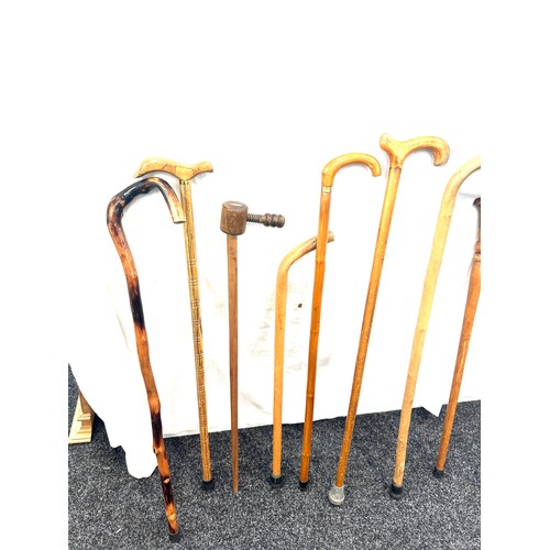 128 - Selection of vintage walking sticks, various handle designs, some carved  (9 sticks in total)