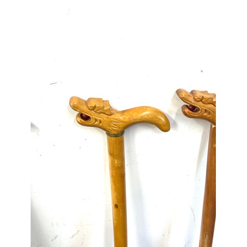 124 - 3 Vintage carved dragon handled walking sticks, with ball in the dragons mouth