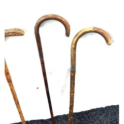 134 - Selection of 4 vintage walking sticks, with silver rims