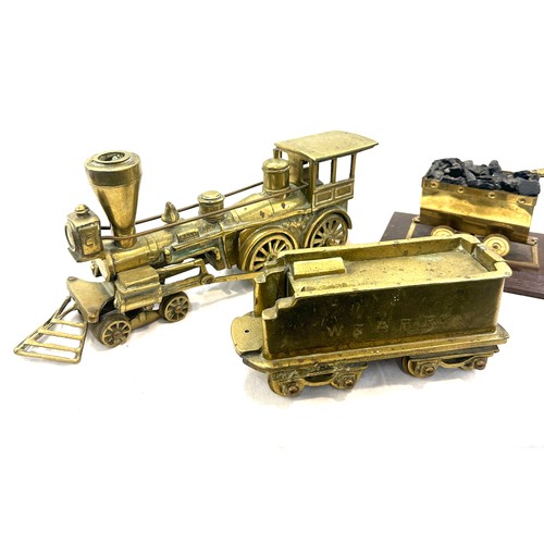 43 - Brass train and tender, miner figure, approximate measurement of train and tender: 20 inches, height... 