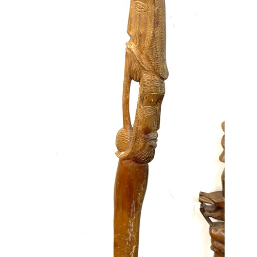 136 - vintage Carved tribal double head stick and 1 other